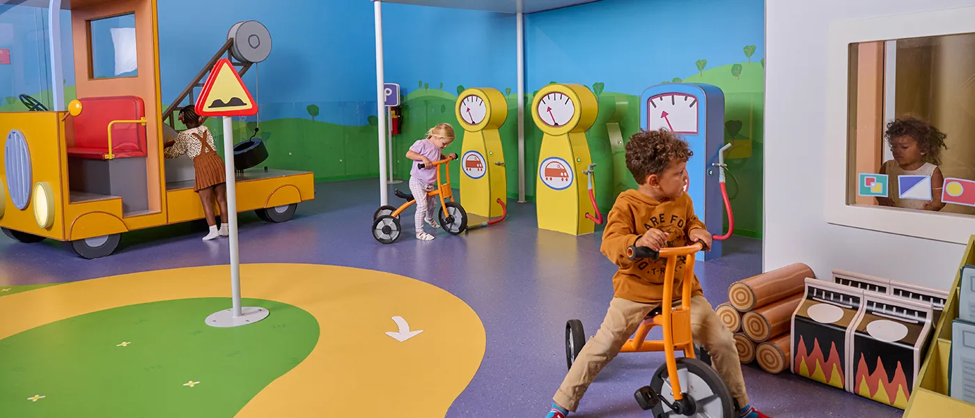 Peppa Pig World of Play Dallas Endless Annual Pass Sale, featuring joyful children playing in colorful Peppa-themed areas with bright, playful graphics